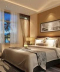 Elegantly decorated bedroom with warm lighting and artwork on the wall, featuring a cozy double bed and large window view.