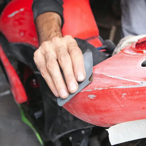 Person using Waterproof Sandpaper Kit Pro Grade With 36 Assorted Grit Sheets From 120 To 2500 for car polishing