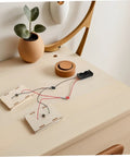 All-In-One Electrical Circuit Kit For Kids on wooden table with components for Safe Materials For Physics Experiments