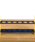 Large Plastic Test Tube Rack For Classroom Use, durable blue and yellow organizer for hands-on science experiments on wooden table.