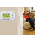 Easy To Use Programmable Thermostat With Four Daily Programs And Menu Driven Setup, wall-mounted in living room