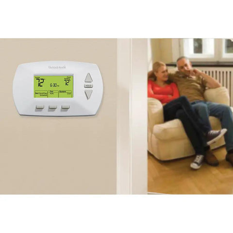 Easy To Use Programmable Thermostat With Four Daily Programs And Menu Driven Setup, wall-mounted in living room