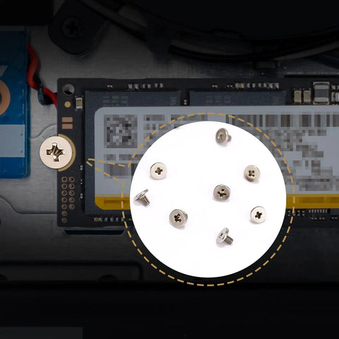 Close-up of 46 Pieces NVMe M.2 SSD Mounting Screws Kit with magnetic screwdriver attaching SSD to motherboard in laptop