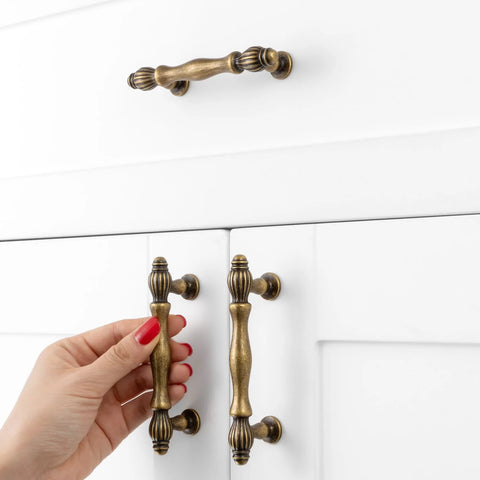Set Of 10 Antique Brass Cabinet Pulls 3 Inch Center To Center Drawer Handles For Kitchen Cabinets installed on white cabinet