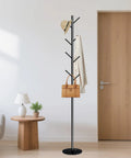 Freestanding Coat Rack With Marble Base And Eight Heavy Duty Hooks in a modern room holding hat, coat, and handbag