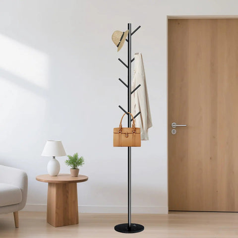 Freestanding Coat Rack With Marble Base And Eight Heavy Duty Hooks in a modern room holding hat, coat, and handbag