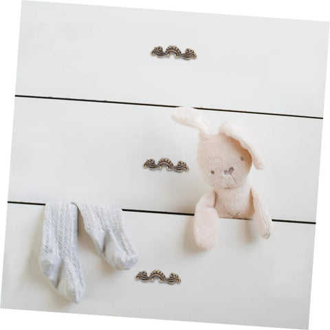Image of a white dresser with Vintage Retro Drawer Handles Set For Jewelry Boxes And Small Cabinets Mini 56x17mm in antique gold color.