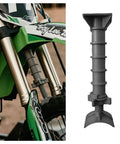 Adjustable Motorbike Fork Stand Heavy Duty Dirt Bike Transport Rack close-up of fork stand on green motocross bike