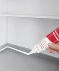 Person applying Advanced Silicone Caulk Sealant For Kitchen And Bath Waterproof Bonding Interior Exterior Use Heavy Duty Strong Adhesion Shrink Proof And Crack Resistant 5.3 Oz White to countertop edge