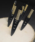 Six Piece Tactical Combat Kunai Throwing Knife Set with 6-inch blades in black 440 stainless steel on wooden surface