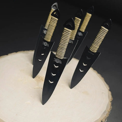 Six Piece Tactical Combat Kunai Throwing Knife Set with 6-inch blades in black 440 stainless steel on wooden surface