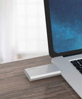 Silver pocket USB 3.0 mSATA enclosure connected to a laptop, showing use of 'Turn Your Spare mSATA Drive Into a Pocket USB 3.0 SSD With No Cable Required, A Grab And Go Enclosure For 30mm And 50mm mSATA, Up To 4TB, 5 Gbps USB External Storage For Laptops And Desktops Not For SATA Mini PCIe'.