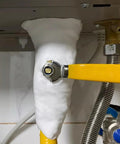 No-Sweat Heavy Duty Waterproof Sealant Mastic For Home Repairs filling a pipe gap under a sink, featuring a yellow valve handle.