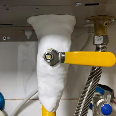 No-Sweat Heavy Duty Waterproof Sealant Mastic For Home Repairs filling a pipe gap under a sink, featuring a yellow valve handle.
