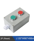 Angled top view of metal push-button control box with two buttons (green and red) and side cable gland.