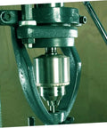 Iron Mortise Converter Runs Tight On Bench Drills Clips Right Onto Hollow Chisel Bits With Tenon Gauge Tool. Close-up of the device in use.