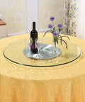 Premium Tempered Glass Lazy Susan Turntable featuring a sleek swivel design on a dining table with wine and flowers.