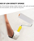 Person using a low-density sponge paint roller for a smooth wall finish, part of 10 Pack Replacement Sponge Paint Roller Covers For Walls.