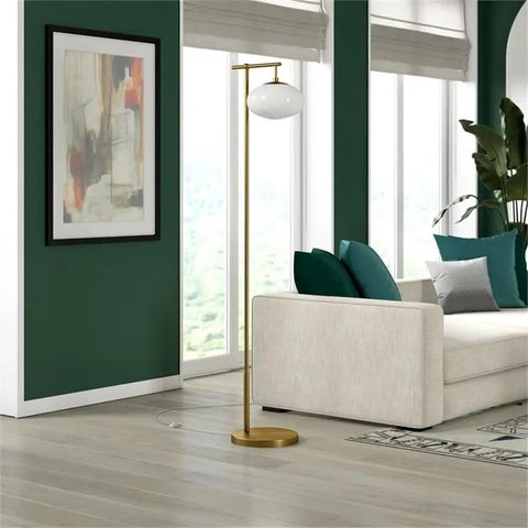 Living room with Go To 68 Inch Tall Arc Floor Lamp With Glass Shade In Brushed Brass And Milk White near cream sofa and art.