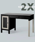 Front view of a black desk with a beige-framed left cabinet, a top center drawer, and silver metal legs.