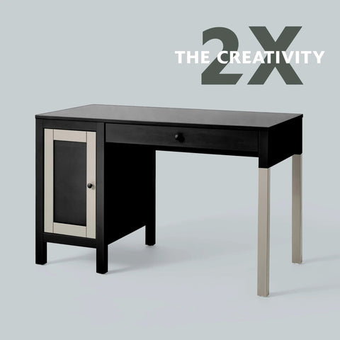 Front view of a black desk with a beige-framed left cabinet, a top center drawer, and silver metal legs.