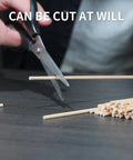 Person cutting Top Shelf 1/8 X 12 Inch Wooden Dowel Rods 150 Pack For Crafts And Diy Projects Ultra Smooth Hardwood Sticks.