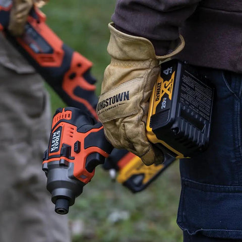 Person holding 20V Battery Powered Impact Driver With One Quarter Inch Hex Quick Connect 210 Foot Pounds Max Torque Brushless Motor