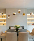 Mid-Century Glass Globe Pendant Light Fixture In Black And Gold, Semi-Flush Ceiling Chandelier For Kitchen Island setting