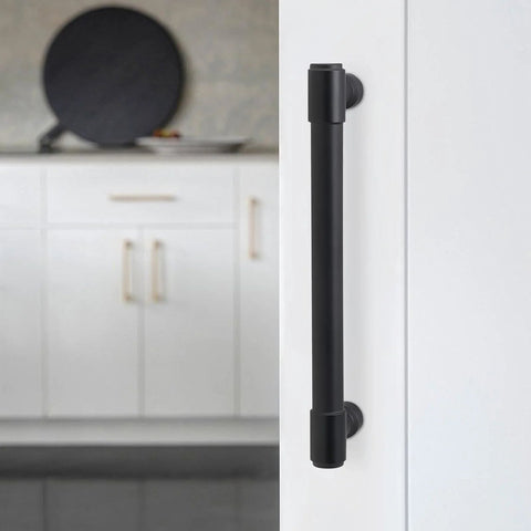 Close-up of matte black cabinet handle installed on white cabinet, part of 10 Pack 5 Inch Matte Black Cabinet Handles For Kitchen Cabinets And Drawers Alloy Drawer Pulls Solid Cabinet Hardware Wide Application Easy To Install Durable And Stylish Includes Mounting Screws For Quick Install And Smooth Operation.