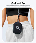 Person carrying Dope Bluetooth Shower Speaker With IP67 Waterproof, Floats, And 20 Hours Of Playtime attached to waist strap.