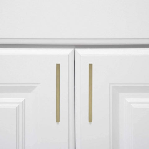 Modern Square Cabinet Pull Handle With Golden Champagne Finish, 5.39-Inch Length, 5-Inch Hole Center, installed on white cabinet doors
