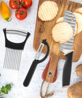 Crinkle cutter with onion holder; black-handled stainless steel wavy blade shown with sliced potatoes on cutting board.