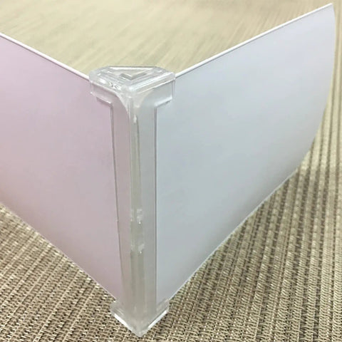 Solid As A Rock Plug And Play Four Piece 3.5 Inch Transparent Vertical Blind Valance Corners showing corner clip detail.