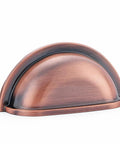 Front view of 3 Inch Bin Cup Drawer Cabinet Pull in Antique Copper Finish, part of a 10 pack kitchen cabinet hardware.