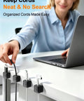 Person using 8 Pack Cord Organizer Holders With Strong Adhesive Magnetic Cable Management For Desk, neatly holds cables.
