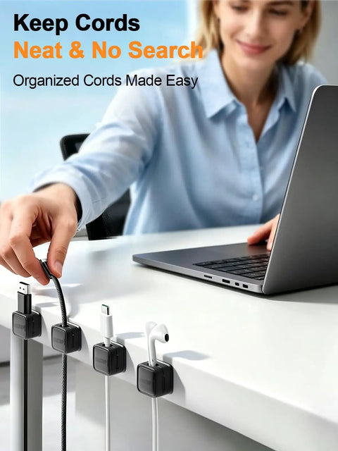 Person using 8 Pack Cord Organizer Holders With Strong Adhesive Magnetic Cable Management For Desk, neatly holds cables.
