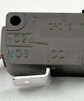 Miniature V7-1Z29E9 Snap Action Switch With Pin Plunger Actuator showing silver contact and label details on body.