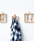 Premium Heavy Duty Solid Wood Wall Mounted Coat Rack With Dang Handy Key Holder Hooks For Entryway Mudroom Bedroom Closets And A Totally Rad Spot To Kick Back Your Daily Gear with decorative animals and a blanket.