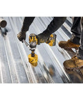 Top Shelf 20V MAX Cordless Hammer Drill Sold As A Bare Tool Rig using a half inch chuck on metal surface for drilling.