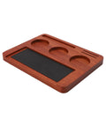Solid Wood Espresso Tamper Station With Silicone Mat And Seven Piece Barista Gear featuring a wooden base and black mat for tamping.