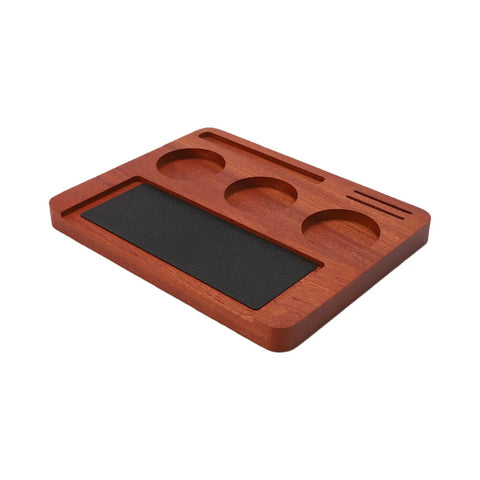 Solid Wood Espresso Tamper Station With Silicone Mat And Seven Piece Barista Gear featuring a wooden base and black mat for tamping.