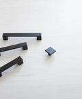 10 Pack Matte Black Kitchen Cabinet Handles Low Profile Drawer Pulls in modern square design on light surface