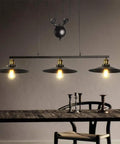 Top Tier Industrial Led Chandelier With Reliable Pulley Pendant Setup Modern hanging light fixture over a rustic wooden table.