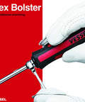 Megadora Impacta Screwdriver Set, hand gripping red and black handle with a metal hex bolster for wrenching.