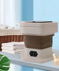No Sweat Portable Folding Mini Washer Featuring Quick Wash And Spin Cycle, 5.5 Pound Capacity, Slick Khaki Build displayed on a countertop.