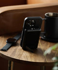 Solid Pick 20W Magnetic Power Bank With Built In Cables 10000mAh Fast Charging Battery MagSafe Compatible on a wooden table.