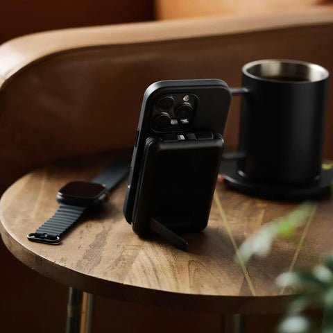 Solid Pick 20W Magnetic Power Bank With Built In Cables 10000mAh Fast Charging Battery MagSafe Compatible on a wooden table.