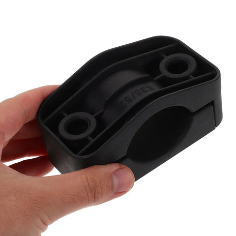 Heavy Duty Black Plastic Cable Clamps Plug And Play Wire Fasteners For Electrical Panels And Power Cords No Fuss Slick Mounting seen in hand.