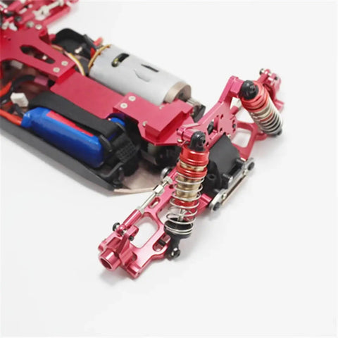 Premium Metal Steering Blocks C Hub Carriers Slick Silver Wheel Hubs close-up view of red metal C-Hub carriers on RC crawler chassis