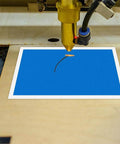 PLIGREAT blue laser-marking paper sheet under engraving head on a laser machine